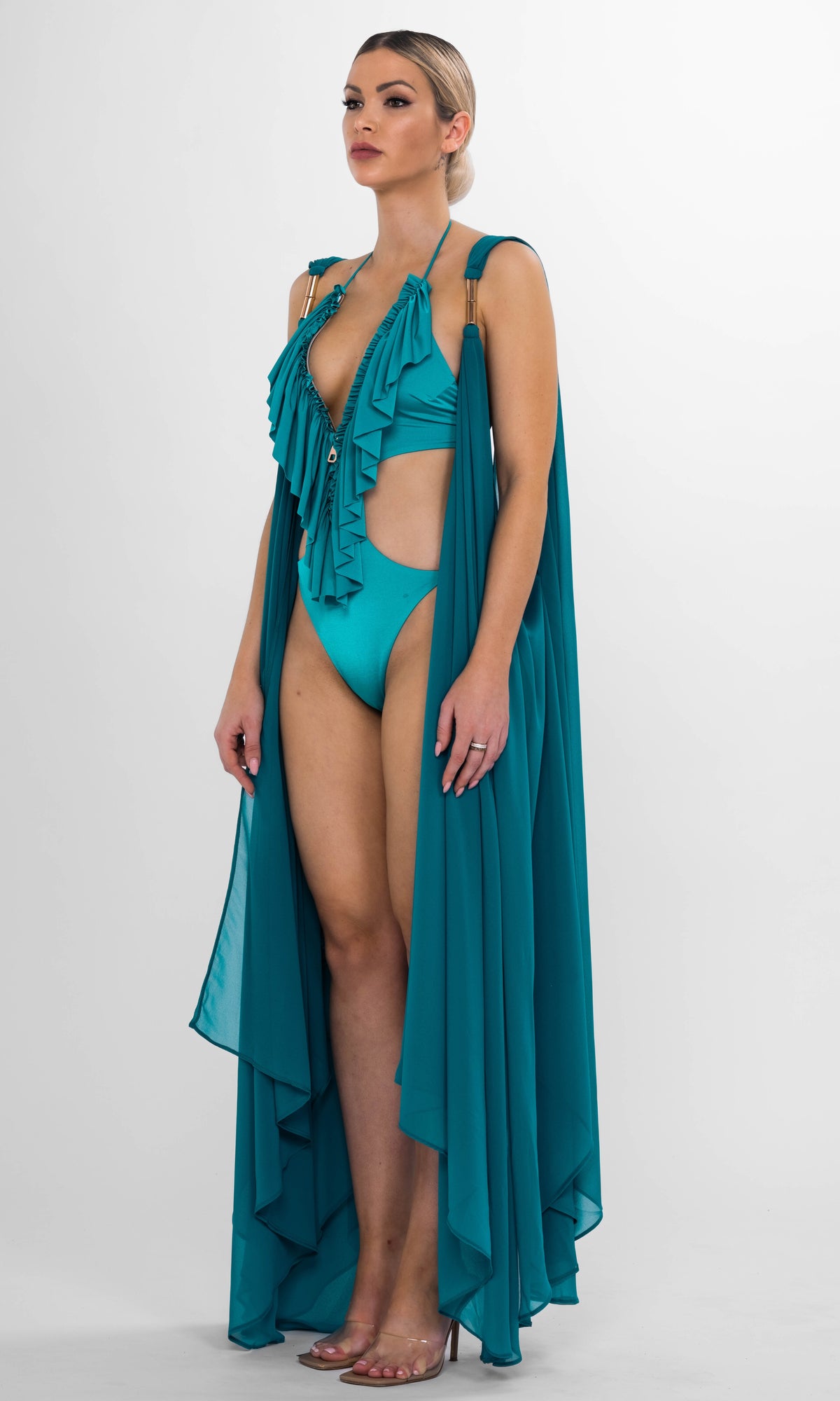 Luxury Clementine beach coverup in petrol by Antoninias, crafted with lightweight fabric and gold-tone accents for an elevated summer style.