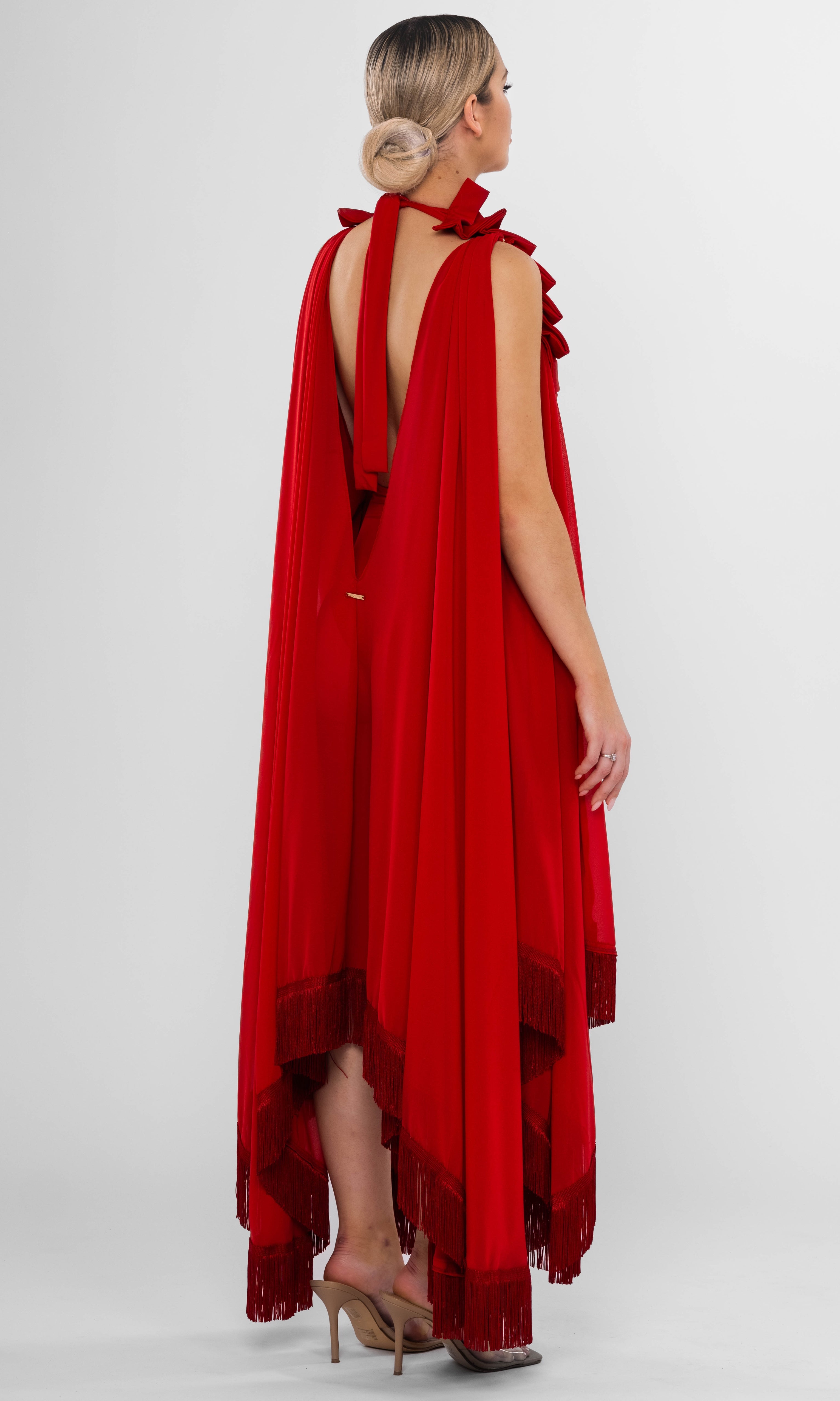 Luxury sustainable Resetius cover-up in red by Antoninias, designed with flowing silhouette, layered fringe hem, and gold-tone belt, perfect for premium resort wear and sophisticated womenswear.