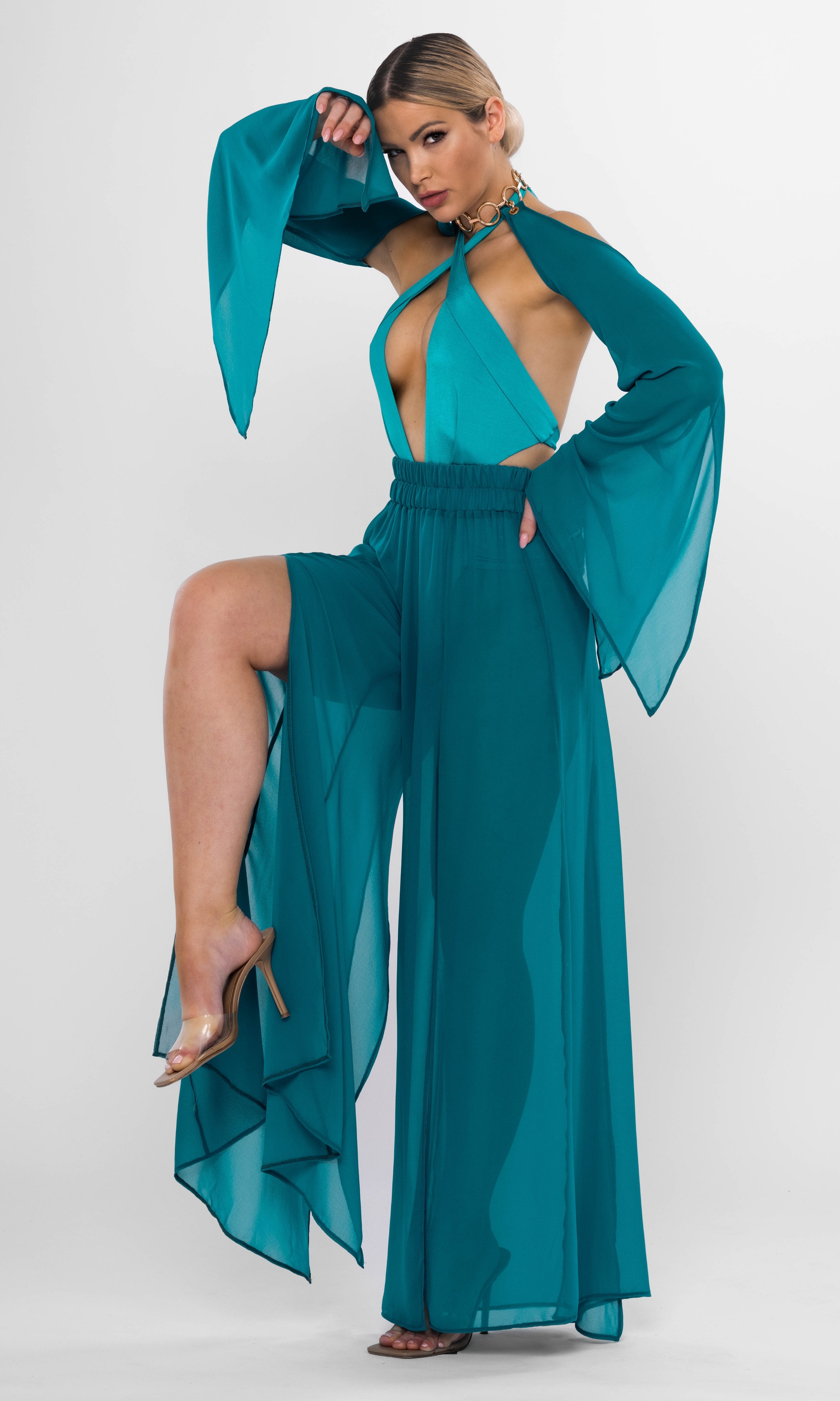 Melanie one-piece swimsuit in petrol by Antoninias, showcasing a sophisticated silhouette with ruched details and a cross-neckline — perfect for luxury beach days.